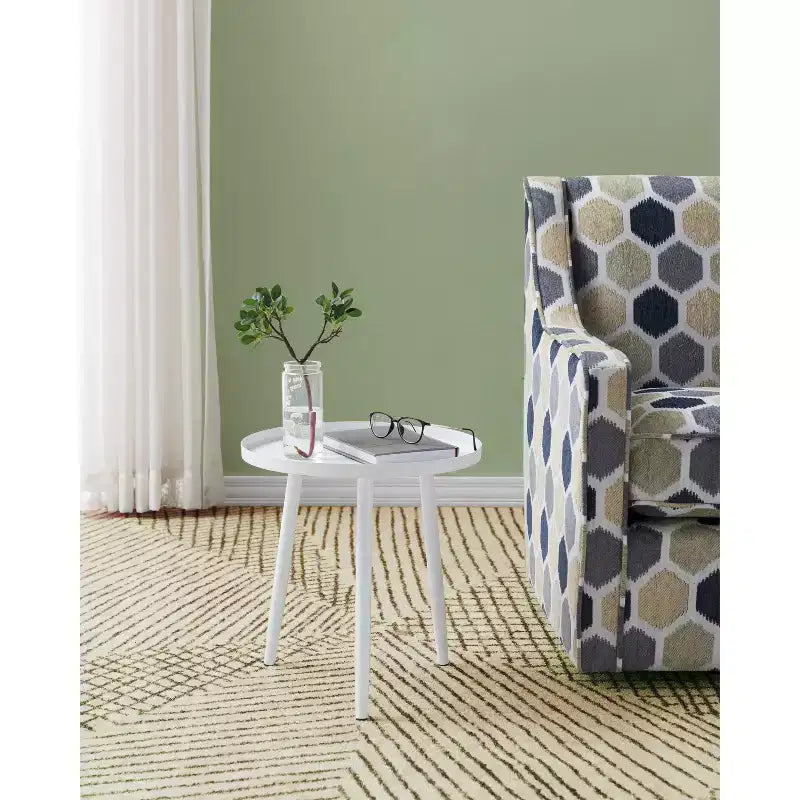 Tavolino / Comodino rotondo in metallo nero, design minimalista a piedistallo
